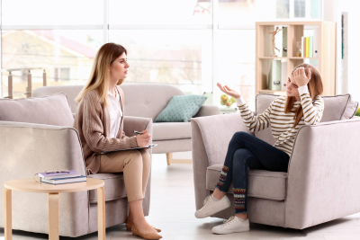 young woman and woman talking